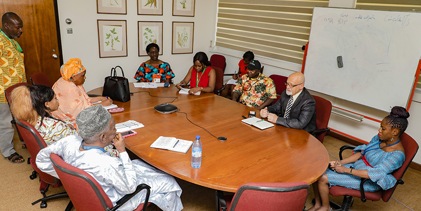 Mrs Barry in a meeting with the IITA management team.