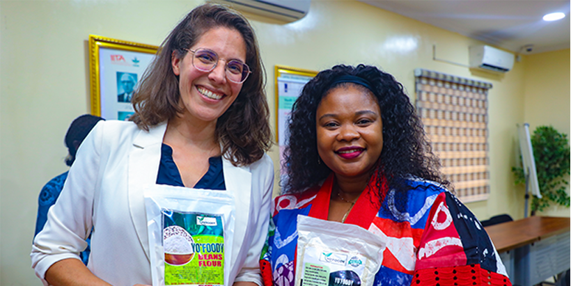 A member of the delegation, Ms. Stephanie Wellink (left); and YAS Team Lead, Ms Aline Mugisho, at the Exhibition (right).