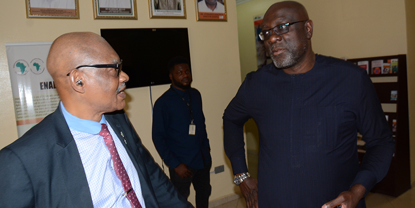 National President of the Nigerian Institute of Food Science and Technology (NIFST), Prof. Madu O. Iwe, speaking with GAIN Nigeria Country Director Dr Michael Ojo during the launch.