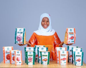 Opeyemi Aminat of PEMNIA WELLNESS showcasing some of her products.