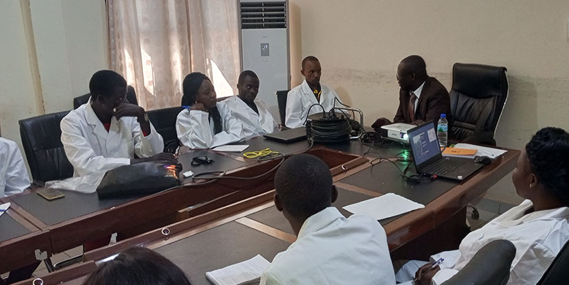 PADECAS Coordinator speaking with seed inspectors at a training in Bangui.