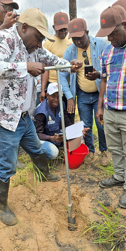Participants collecting soil samples during the field assessment.