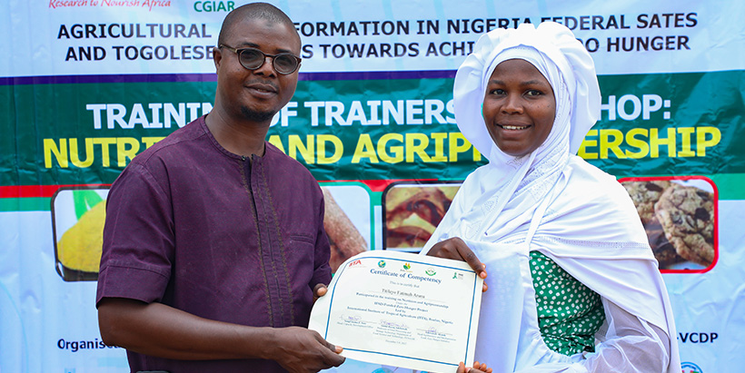 Presentation of Certificate to one of the trainees by FUNAAB Prof. Abdul-Rasaq Adebowale.