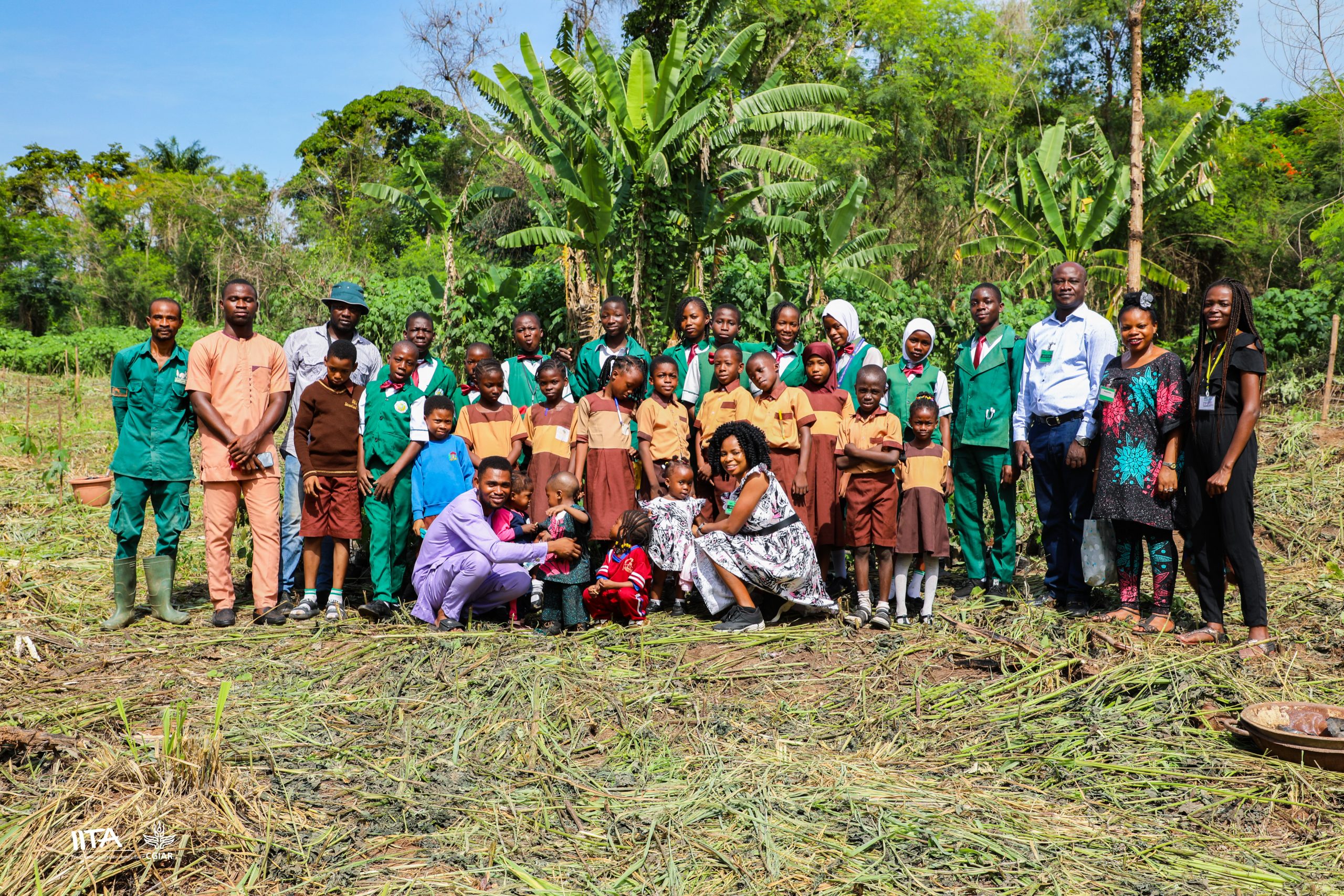 Pupils, teachers, and some Forest Center staff after planting seedlings at the burnt area.