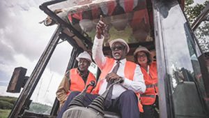 Hon. Linturi breaking ground for the construction of RTB-EAGEL flanked by Dr Morag Ferguson.