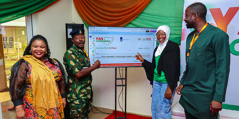 Representative of the Nigerian Army Farms and Ranches Ltd, Major Y. U. Rabiu (2nd left); presenting an e-cheque to the winner of the business pitch competition, Azeezat Olatunji (2nd right).