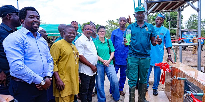 Representative of the Ogun State Commissioner for Forestry, Engineer Taiwo Oludotun, commissioning the borehole donated by Nigerian Breweries for clean and potable water to the people of Olokemeji, alongside IITA DDG Corporate Services, Hilde Koper-Limbourg, the Baale of Olokemeji, Fashola Jamiu, and other dignitaries.