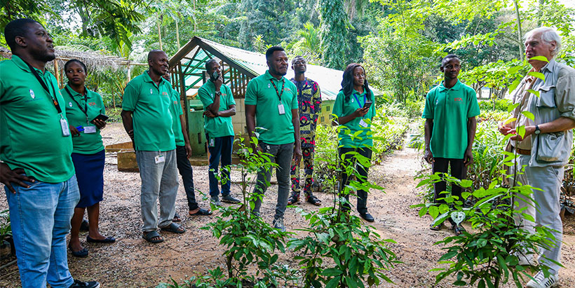 Dr John Peacock with IITA Forest Center staff at the ethnobotanical garden, reliving past moments, successes, and achievemnts.