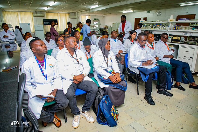 Participants listening to a facilitator during the training.
