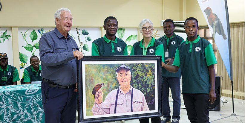 Sir Phil Hall receiving his hand-painted art flanked by Manager of IITA Forest Center, Adewale Awoyemi; IITA DDG Corporate Services, Hilde Koper-Limbourg; IITA Forest Center