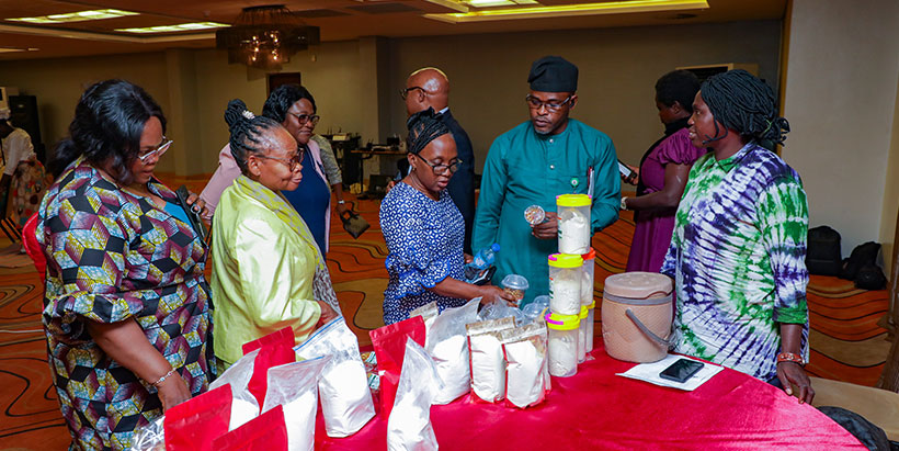 Some participants at the exhibition stand of a agribusiness owner.