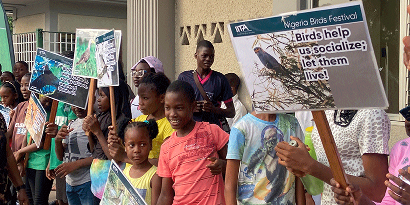 Students bearing placards with important bird messages for sensitization