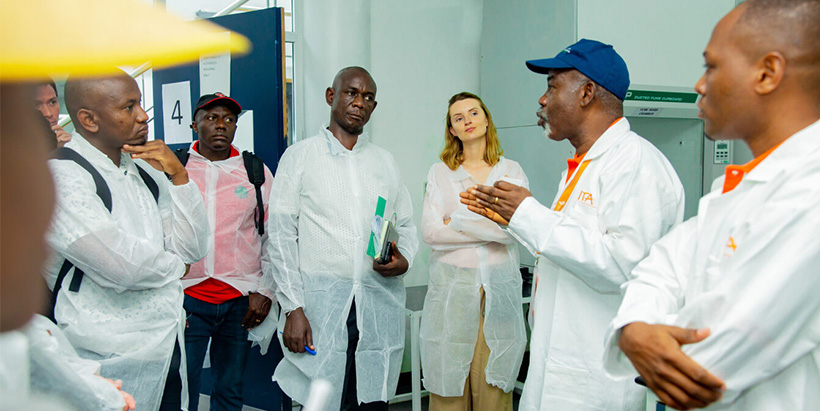 TAAT Cassava Compact leader and value chain specialist Dr Adebayo Abass explaining to participants about activities undertaken in the food laboratory. (Photo: IITA)