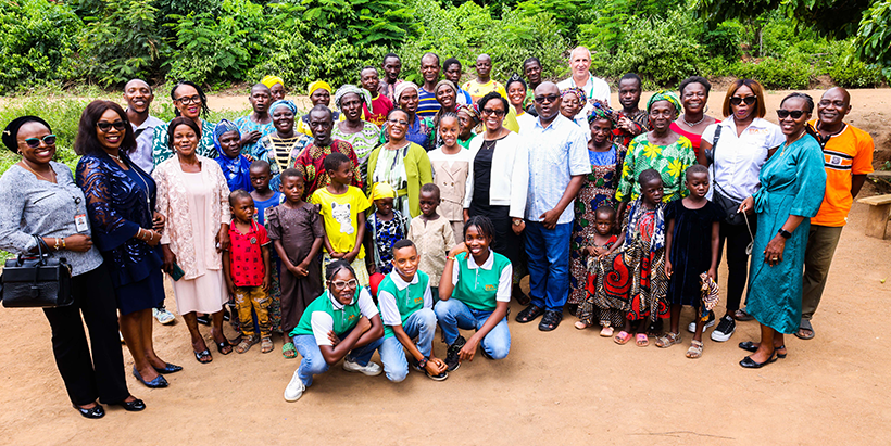 The people of Aleelo heartily receive the gift of clean refreshing water from Namatai Tembo.