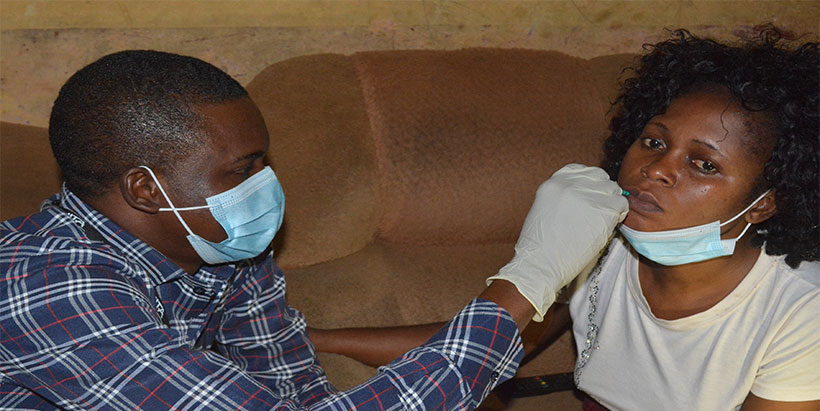 Field teams giving a dose of vitamin A to the respondent (WRA) in the pilot.