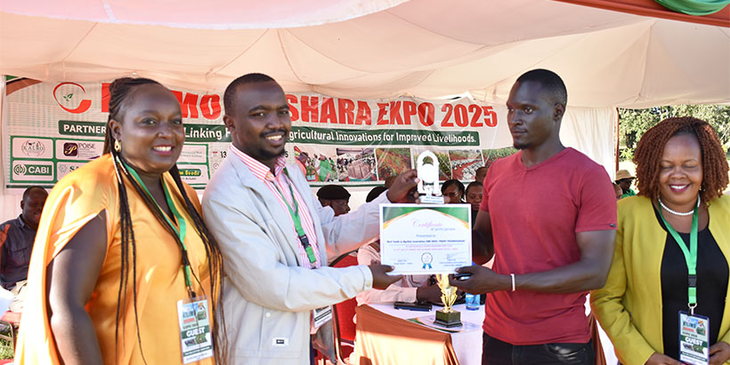 Youth receiving certificate for best exhibition.