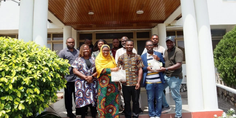 Participants during the Early Generation Seed engagement meeting in Accra, Ghana. Prof. Morufat Balogun, IITA (2nd left) and Dr Djana Mignouna, IITA (1st right) handing over the yam seeds to Dr Kwabena Darkwa, SARI (middle) and Dr Victor Acheampong Amankwaah (2nd right).