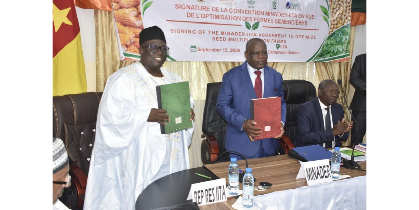 Dr Komi Fiaboe, IITA’s Central African Hub Director (left) and Minister Gabriel Mbaïrobe, MINADER (right), with the signied agreement.